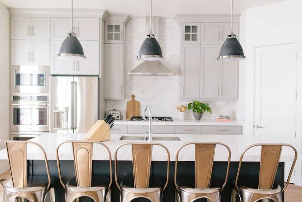 Multifunctional Kitchen Island Provides Counter Space and Seating for Five Multifunctional Kitchen Island Provides Counter Space and Seating for Five