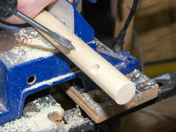 Drill through the holes using the 3/8" bit.