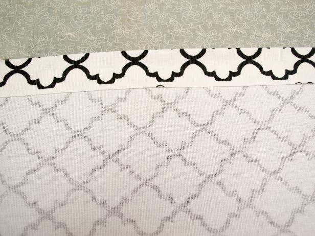 Fold in the top and bottom edges of the fabric one inch and press with an iron.