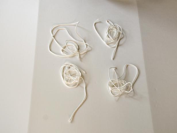 Cut four equal pieces of nylon rope.