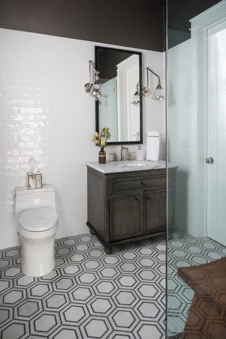 White Bathroom With Gray Vanity and Hexagon Floor Tiles