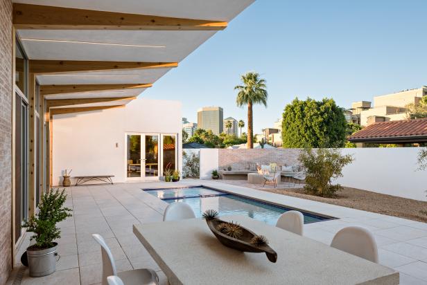 Modern Poolside Dining Area With Tropical City View Modern Poolside Dining Area With Tropical City View