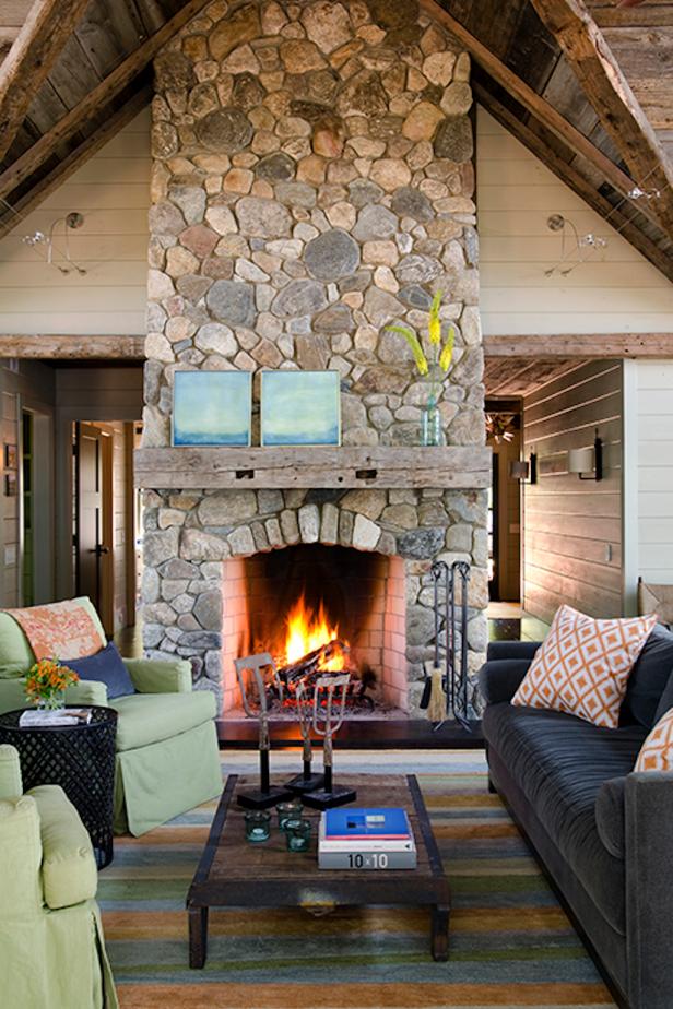 Neutral Living Room With Green Armchairs, Rustic Fireplace