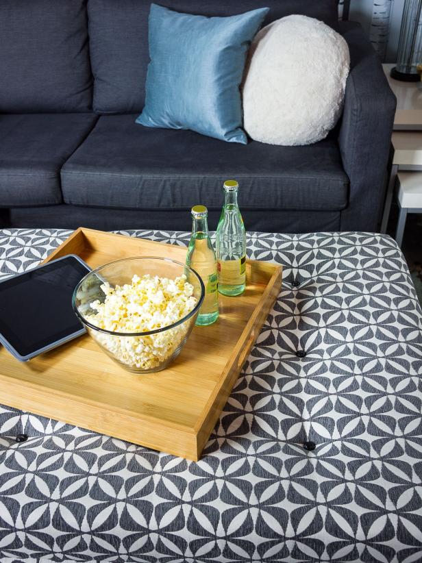 Turn an old coffee table into a stylish storage ottoman. It will be big enough to use as a coffee table with a tray, as extra seating, or just a great place to prop up your feet at the end of the day. The handy lift lid reveals plenty of storage for throws, books, or board games.
