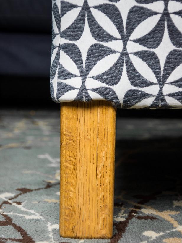 For the legs, cut small notches in the fabric where the leg meets the side of the table up to the bottom of the side. Use your fingers to carefully tuck the fabric up behind the batting on the legs.