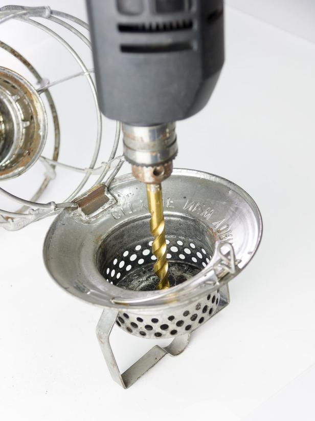 Using a ½âdrill bit, drill a hole in the top of the lantern hood in the center. Insert the threaded lamp rod and secure on the inside with a lamp rod bolt. Secure on the outside with a hollow finial. Screw the candelabra socket to the lamp rod on the inside of the hood using the attached threaded base.