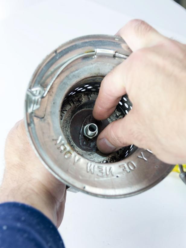 Using a ½âdrill bit, drill a hole in the top of the lantern hood in the center. Insert the threaded lamp rod and secure on the inside with a lamp rod bolt. Secure on the outside with a hollow finial. Screw the candelabra socket to the lamp rod on the inside of the hood using the attached threaded base.