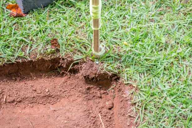 Dig a 6-inch deep footprint for each block.