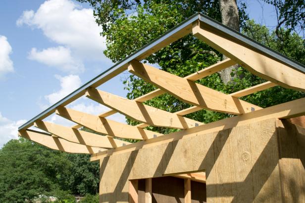 Attach drip edge to the rear, side and front edges of the roof using 1 ½ inch galvanized nails. Three inch overlaps are made at seams so that the upper piece laps over the lower piece.