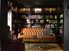 Luxurious Library with Rich Toned Woods and Fabrics