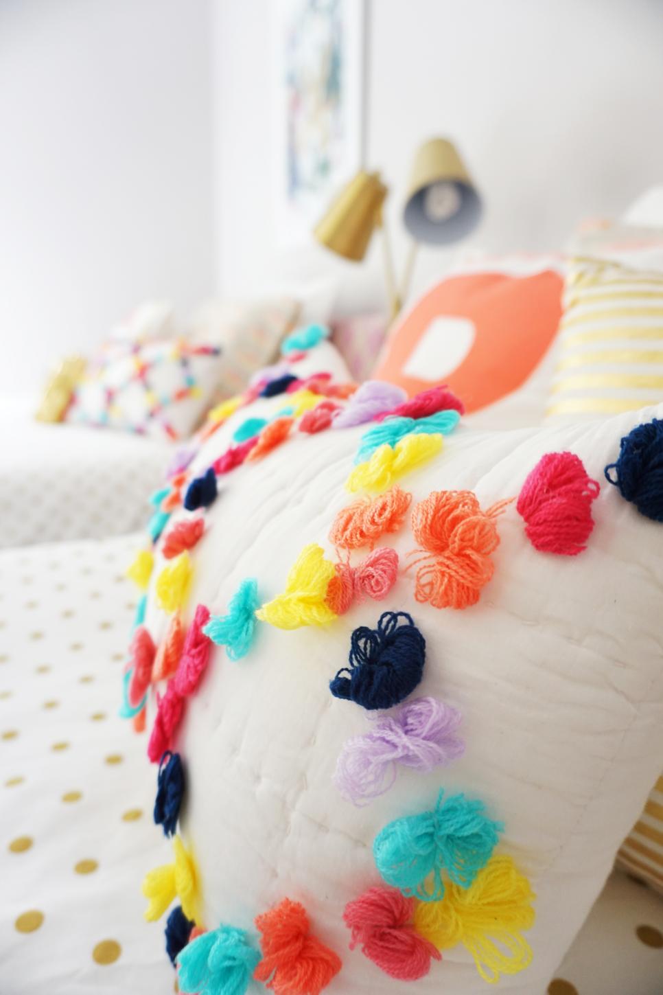 Girl's Bedroom With Colorful Pom Pom Throw Pillows Bedroom With Colorful Pom Pom Pillows and Gold Polka Dot Bed Linens