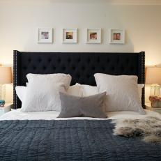 Tufted Navy Headboard and Faux Fur Accent Throw Over Comfy, Contemporary Bed 