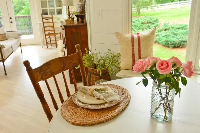 Farmhouse Kitchen with Burlap Pillows and Wood Furniture
