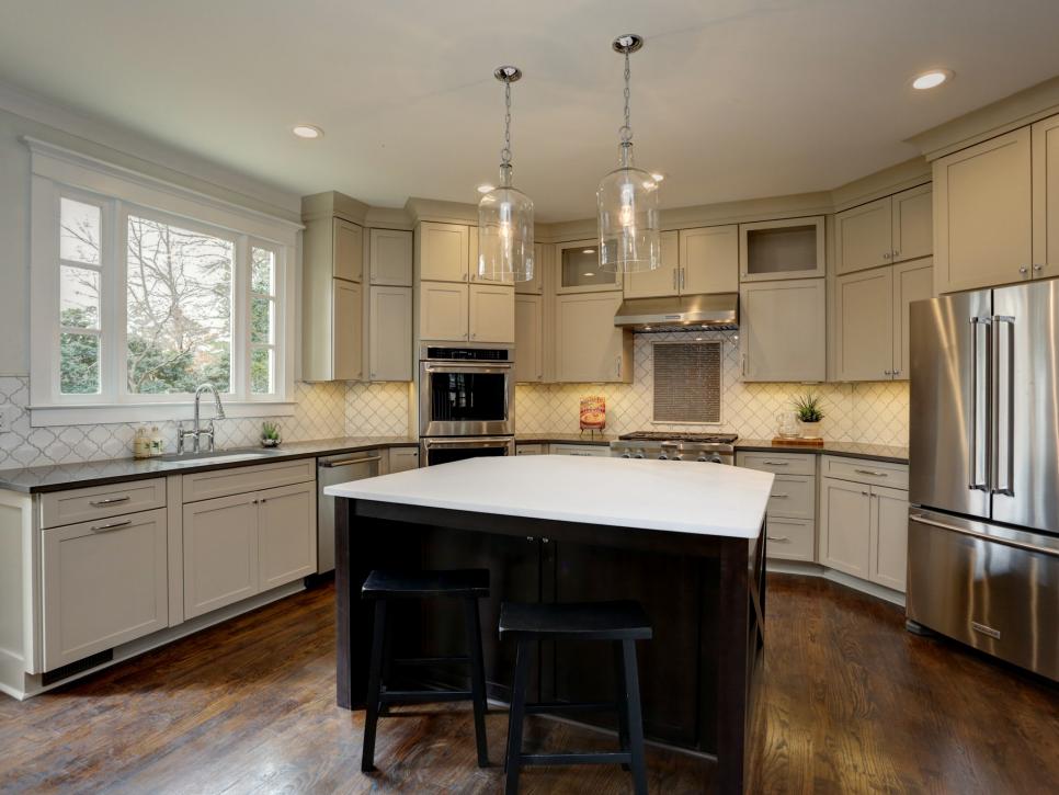Transitional Kitchen with Island, Tile Backsplash and Stainless Steel Appliances Transitional Kitchen with an Island, Tile Backsplash and Stainless Steel Appliances