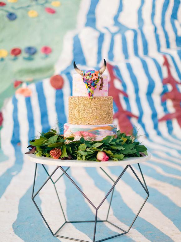 Eclectic Rainbow and Gold Wedding Cake With Southwestern Steer Head Topper Colorful and Sparkly Wedding Cake With Southwestern Steer Head