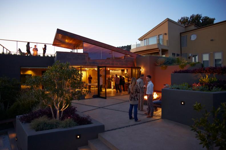 Modern Exterior at Night With Garden and Patio