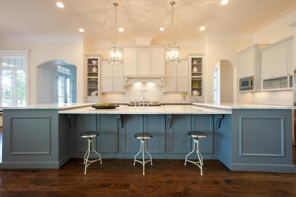 Blue and White Kitchen With Metal Stools