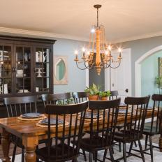 Simply Elegant Country Dining Room With Large Wood China Cabinet, Long Dining Table and Beaded Chandelier 