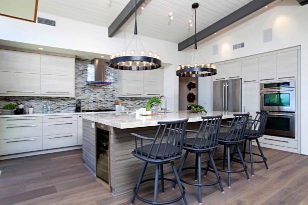 Circular Pendant Chandeliers, Black Bar Chairs and Midcentury Modern Cabinetry in Sleek Kitchen Design Circular Pendant Chandeliers, Black Bar Chairs and Midcentury Modern Cabinetry in Sleek Kitchen Design