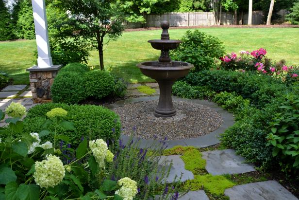 Traditional Garden With Fountain in Center