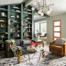 Eclectic Family Room With Bookshelf Wall