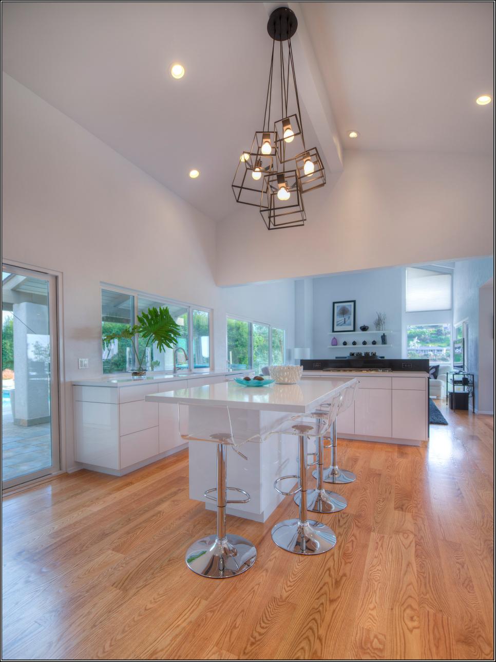 White Modern Open Plan Kitchen With Lucite Stools White Open Kitchen With Lucite Stools