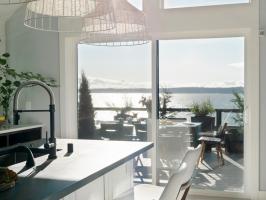 A White Kitchen With Views of the Water