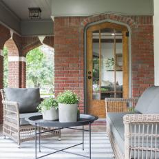 Contemporary Neutral Porch with Beige Wicker Furniture 