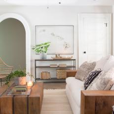 Rustic Neutral Living Room with Arched Doorways 