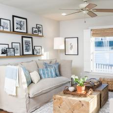 Neutral Cottage Living Room with Gray Sofa and Blue Pillows 