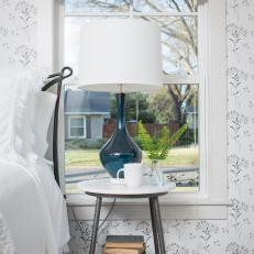 Black and White Cottage Master Bedroom with Blue Lamp 