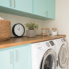 Neutral Midcentury Modern Laundry Room with Blue Cabinets 