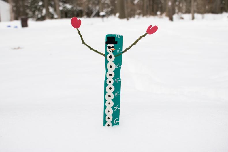 How to make a snowman snow measuring stick.