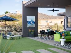 This inviting backyard has space for dining, entertaining and relaxing outdoors, with an updated 1960s modern color palette that includes lime green, black, white and tones of cool blues.
