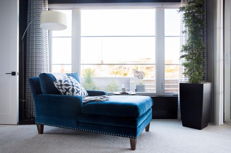 Master bedroom's blue chaise lounge offers a great view