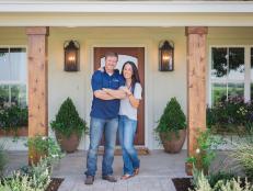 As seen on FIxer Upper, Chip and Joanna Gaines in front of the the Barker's newly remodeled home. (Portrait)