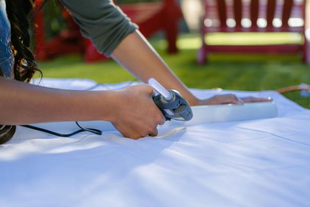 DIY Movie Screen: Glue Sheet Over Second Pipe DIY Movie Screen: Glue Sheet Over Second Pipe