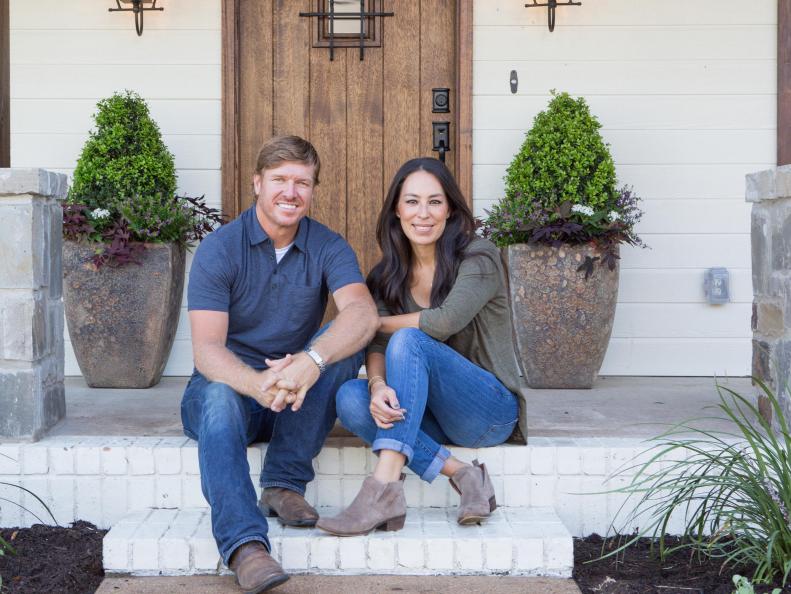 As seen on FIxer Upper, Chip and Joanna Gaines on the Ignacio's rennovated front porch. (Portrait)