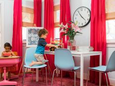 Create a work/play environment that's packed with plenty of storage, work surfaces and designated spots for kids and adults.