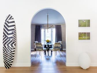 Doorway Draws Playful Contrast to Elegant Dining Room