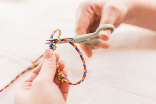 Trim your ends about 1/8” from the base of the knot (Image A).