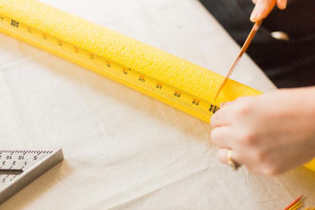 Measure the width of your yoga mat, then cut one of the pool noodles the same size using a serrated knife (Image A).