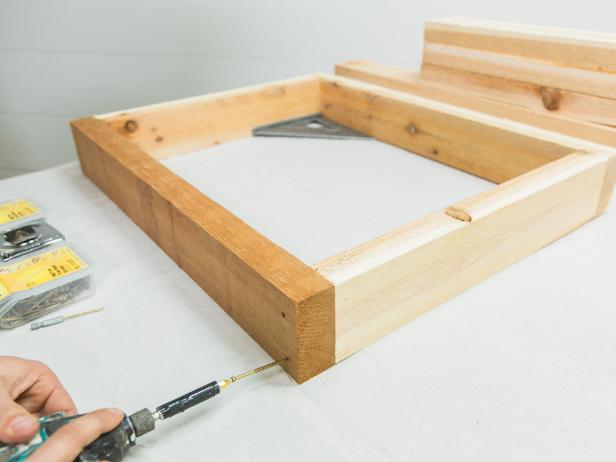 Assemble the smaller bottom shelf frame first, using wood glue, then long wood screws. Always pre-drill first before adding wood screws to avoid splitting the wood. Using the same method assemble the larger countertop frame.  Lastly, add the 19” center brace.