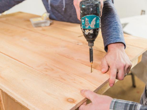 Start with the front board and allow for a 1 ½” overhang. Secure using the 1 ½-inch screws. You may need to rip the last board depending on your dimensions.