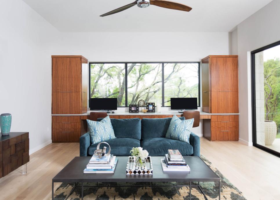 Light and Bright Home Office With Teal Velvet Sofa and Built-In Desk White Home Office With Built-In Wood Desk and Teal Sofa