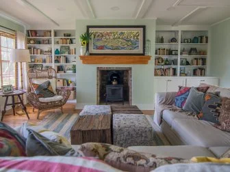 Green Living Room with Brick Fireplace 