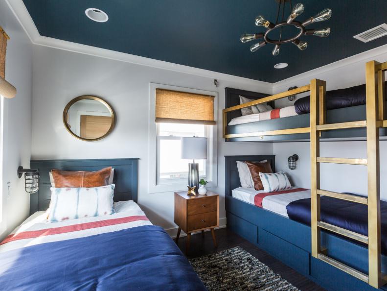 Bunk beds add functionality in a small guest bedroom designed by Jonathan Scott, as seen on Brother vs. Brother. (After #13)