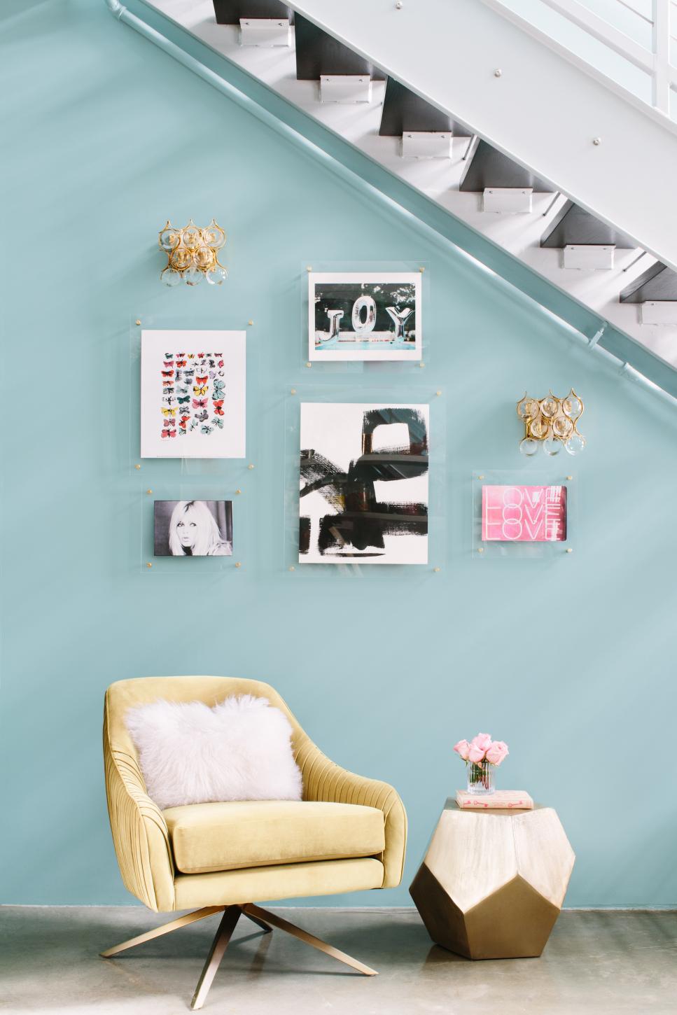 Gallery Wall Underneath the Stairs in Girly Glam Apartment Girly Glam Apartment with Gallery Wall