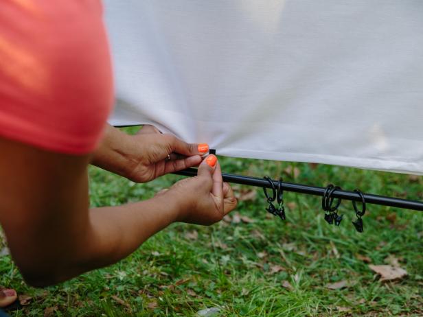 Secure sheet to bottom curtain rod.