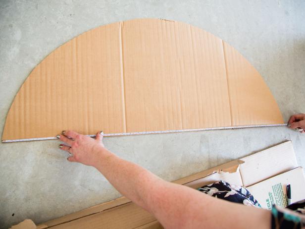 Step 2- Measure for Base & RoofTo create the base and roof, first measure along the bottom of the half circle to determine the length of the base and roof. Next, hold up each side of the car and measure the desired distance between the two pieces. We went with a 10-inch width.